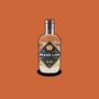 Brass Lion Pahit Pink Gin bottle on an earthy orange background.