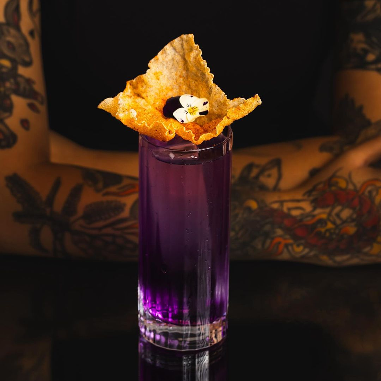 Brass Lion Butterfly Pea Gin cocktail served in a tall glass with creative garnish